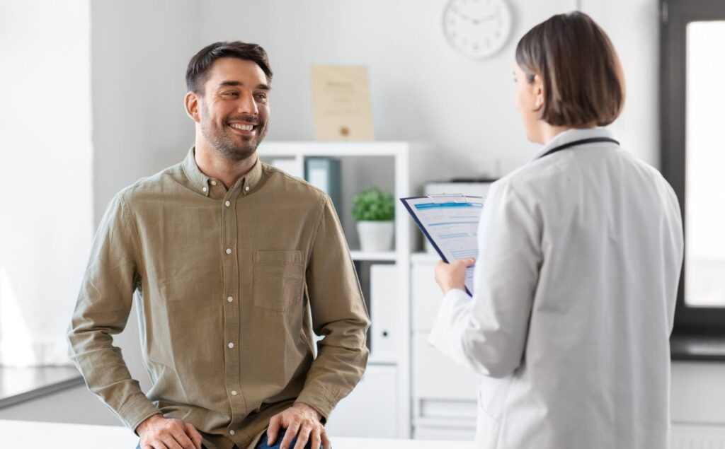 Man smiling during medically assisted treatment in Michigan.