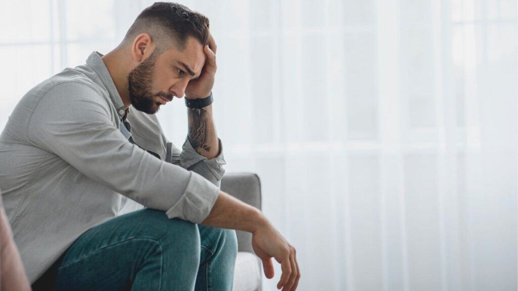 Man experiencing signs of drug addiction.