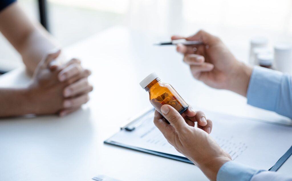 Doctor prescribing medications as part of medically assisted treatment in Michigan.