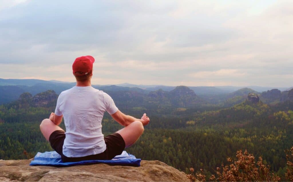 Man practicing meditation as part of holistic recovery.