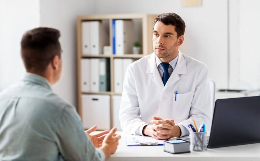 Man receiving medical guidance during alcohol detox in Michigan.