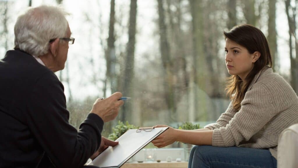 Therapist working with client in an Acceptance and Commitment Therapy in Michigan.