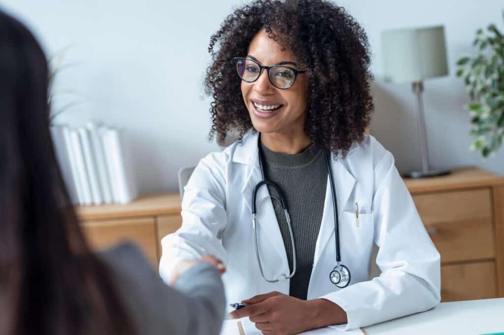 A woman talks to her doctor about stimulant addiction treatment in Michigan.