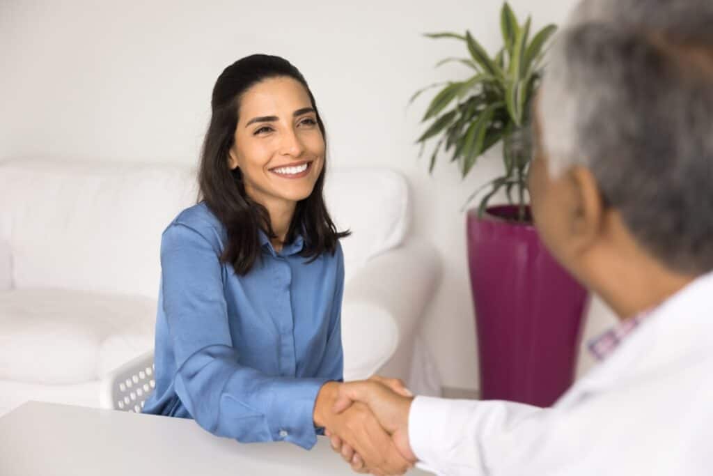 A woman talks to her doctor about holistic treatment options for treatment after completing fentanyl detox in Michigan.