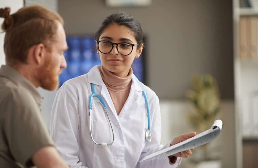 Clinician helping man during codeine addiction treatment in Michigan.