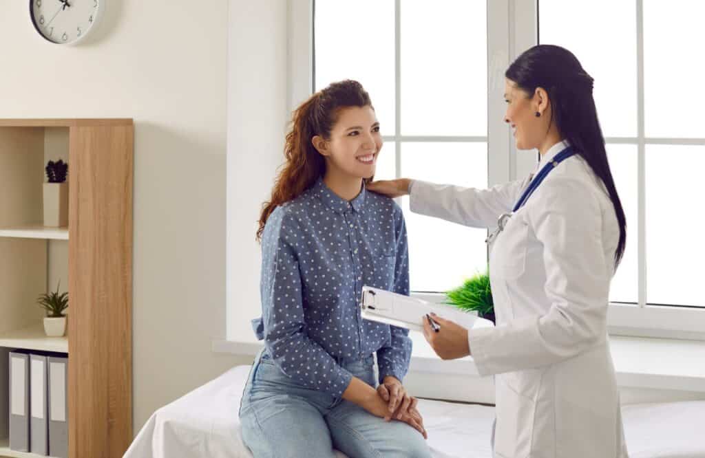 A woman consults her doctor about mdma addiction treatment in Michigan.