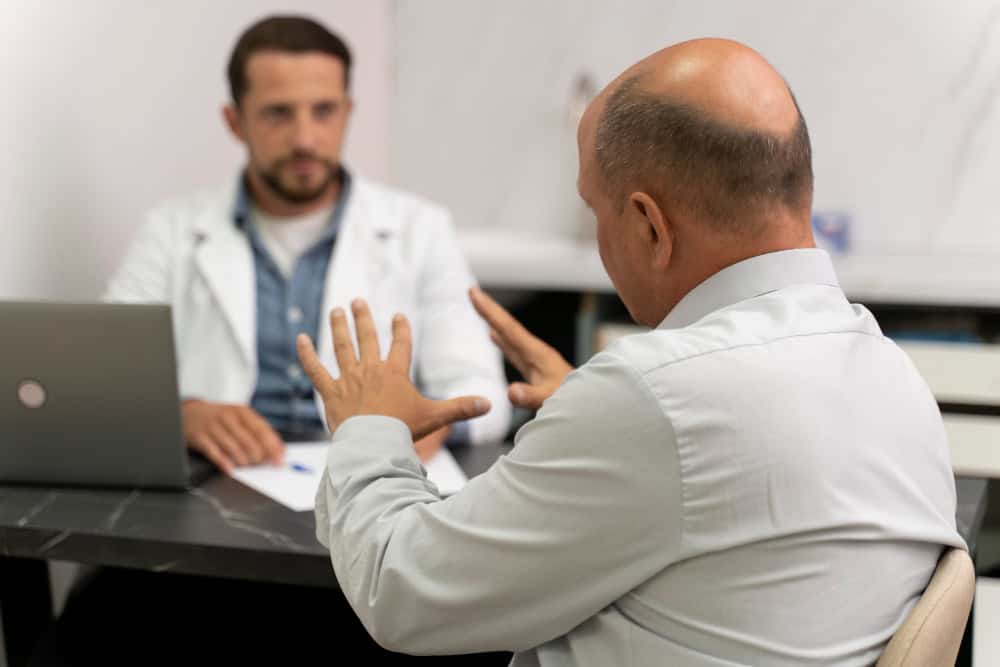 Man receiving medical care during dual diagnosis treatment in Grand Rapids recovery program