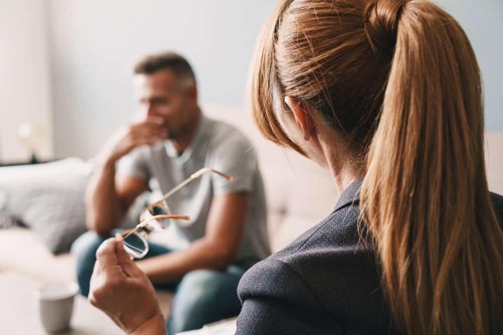 Woman coping with emotional stress during Northern Indiana addiction treatment recovery journey