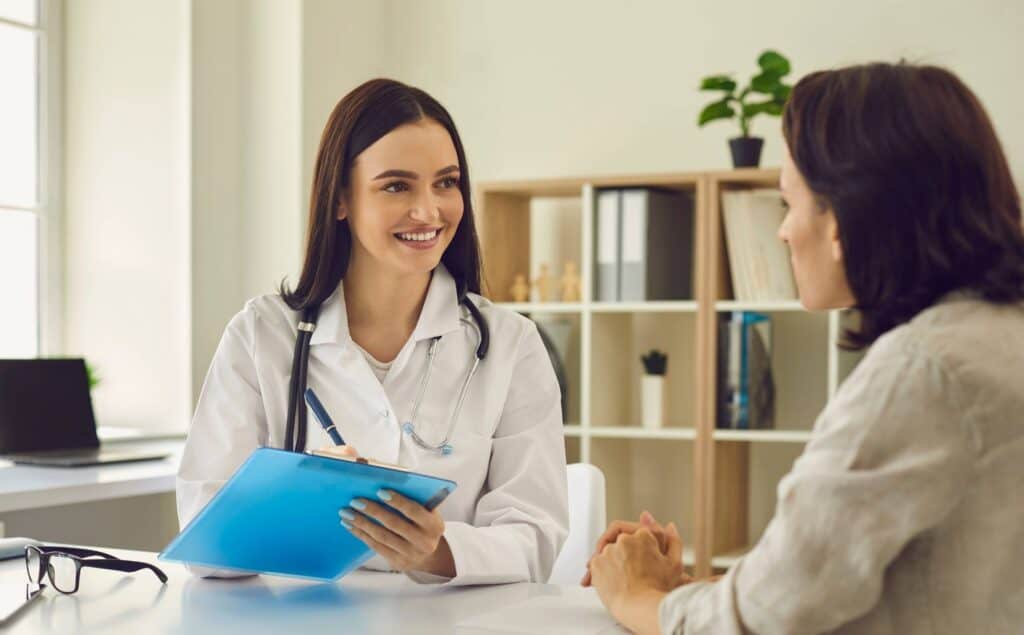 Doctor helping a client during treatment at a rehab serving South Bend, Indiana.