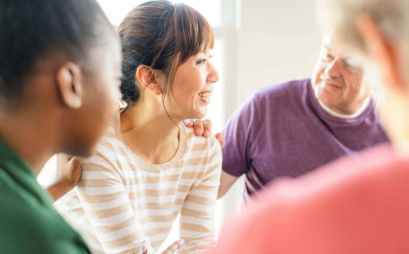 Mutual support and connection among peers during a group therapy session at a rehab near Rockford, IL.