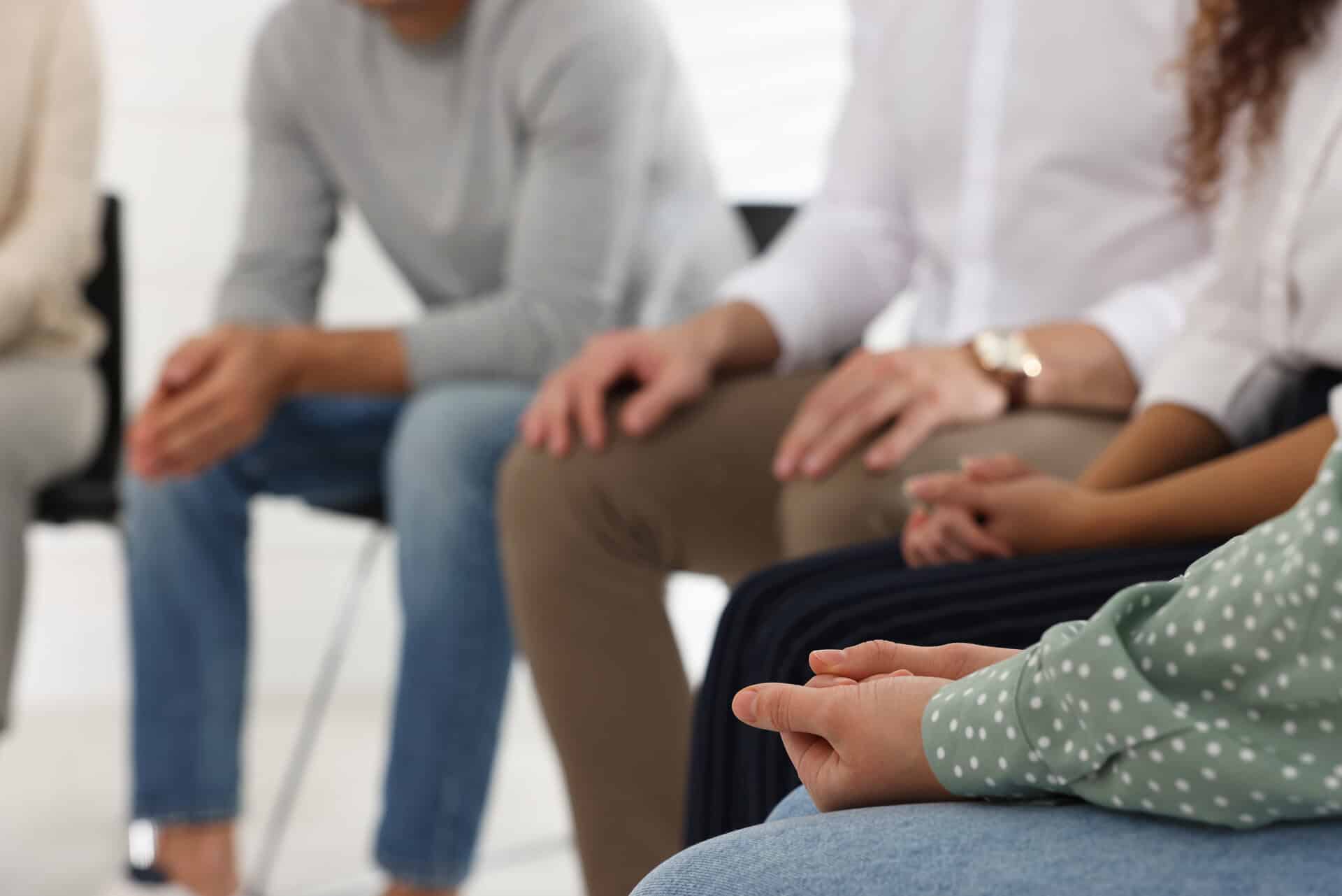 People at group therapy session indoors, closeup at a Drug & Alcohol Rehab in Kalamazoo, MI